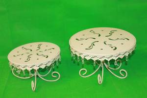 lot 132 image: TOTAL OF 2 VINTAGE ORNATE IVORY ROUND FOOTED CAKE METAL STANDS  8 & 10