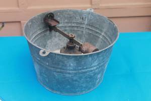 lot 89 image: VINTAGE PERFECTION CASTING MACHINE ATTATCHED TO VINTAGE METAL BUCKET  ,FOR DENTAL OR JEWELRY , 8H X 14 DIAM