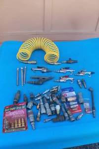 lot 254 image: MISC LOT OF YELLOW PNEUMATICS COILED & SELF STORING HOSE, AIR BLOW GUNS,COUPLERS,AIR CHUCKS,TIRE GAUGES  SEE PICS