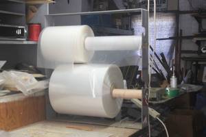 lot 300 image: ROLLS OF POLY WITH TABLE MOUNT STAND