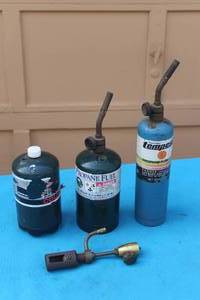 lot 439 image: 3 PROPANE FUELS WITH TORCHES ALL CANS ARE AT LEAST 34 TO FULL