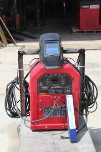 lot 34 image: LINCOLN ELECTRIC AC 225 ARC WELDER WITH CHICAGO ELECTRIC WELDING HELMET 46092 & PROSTAR PREMIUM MILD STEEL ELECTRODES 332 E6011, PLATFORM TRUCK NOT INCLUDED