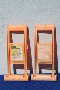 lot 67 image: TOTAL OF 2 ORANGE STANLEY PANEL CARRY  CARRY PLYWOOD & DRYWALL EASIER