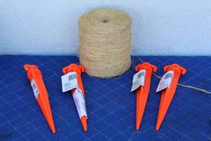 lot 201 image: 4 EVERBILT 11 GROUND STALKES 344923 WITH A ROLL OF NYLON STRING