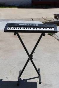 lot 268 image: FIRST ACT PIANO WITH HAMZER STAND