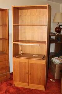 lot 53 image: VINTAGE TEAK WOOD LIGHTED 3-SHELF BOOKCASE WITH SLIDE OUT  SHELF AND LOWER  2-DOOR  CABINET  , 73.5H X 15.5 X 30.5 W