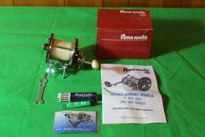 lot 56 image: PENN PEER 209MS  REEL  LEVEL WIND STAINLESS STEEL SPOOL WITH ACCESSORIES IN ORIGINAL BOX