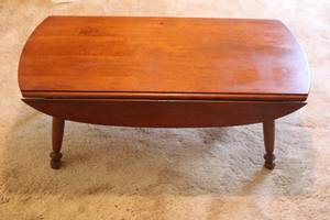 lot 123 image: VINTAGE WOOD OVAL DROP LEAF COFFEE TABLE