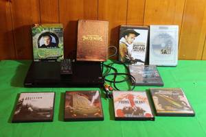 lot 157 image: SONY DVP-SR200P DVD PLAYER WITH 10 DVDS & REMOTE