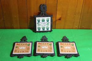 lot 184 image: TOTAL OF 4 VINTAGE CAST IRON CERAMIC TRIVETS