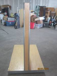 lot 13 image: WOODEN DOUBLE SIDED SLAT WALL DISPLAY STAND ON WHEELS&nbsp