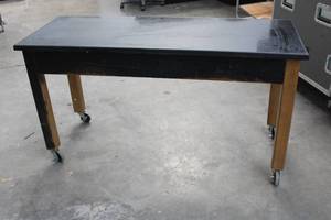lot 45 image: MARBLE TOP WOOD WORK TABLE ON LOCKING CASTERS , 54L X 21W X 29H