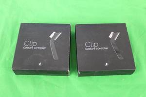 lot 199 image: 2 FLICKTEK CLIP GESTURE CONTROLLERS