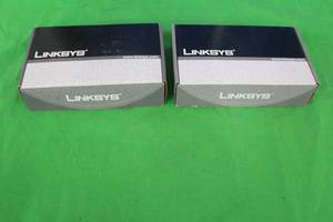 lot 217 image: 2LINKSYS PHONE ADAPTER WITH ROUTER SPA2102