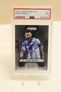 lot 18 image: PSA GRADED NM 7 2018 PANINI PRIZM LIONEL MESSI FIFA WORLD CUP RUSSIA