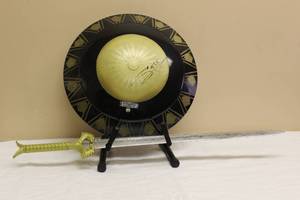 lot 37 image: WONDER WOMAN SHIELD 21 DIAM  METAL GOD KILLER PROP SWORD SIGNED AUTOGRAPH WITH COA