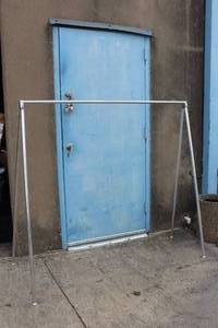 lot 25 image: FOLDING CLOTHING RACK