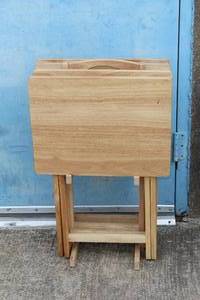 lot 34 image: SET OF FOUR NATURAL WOOD FOLDING TV TRAYS WITH STAND