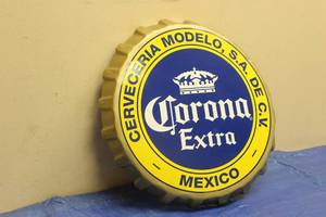 lot 55 image: CORONA EXTRA 20 DIAM METAL BOTTLE CAP SIGN SIZE 20 DIAM