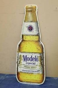 lot 57 image: BARTON BEERS MODELO ESPECIAL IMPORTED BOTTLE SHAPED METAL SIGN SIZE 22 TALL