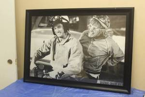 lot 139 image: DUMB &amp DUMBER STARRING JIM CARREY, JEFF DANIELS MOVIE POSTER IN WOOD FRAME , 28.5 H X 40
