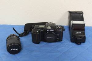 lot 57 image: NIKON 35MM SLR FILM CAMERA N6006 , MINOLTA MAXXUM 2800AF SHOE MOUNT FLASH &amp VIVITAR 35 - 70MM FOCAL CAMERA LENS&nbsp