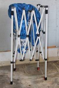 lot 134 image: OZARK TRAIL 10X10 INSTANT SLANT LEG CANOPY ONE METAL ARM BROKEN SEE PICS