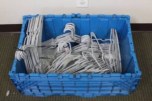 lot 179 image: LOT OF PLASTIC HANGERS TOTE INCLUDED